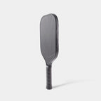 Side angle of LUZZ Pro 4 Darkness Inferno 16mm paddle showing elongated shape and grip