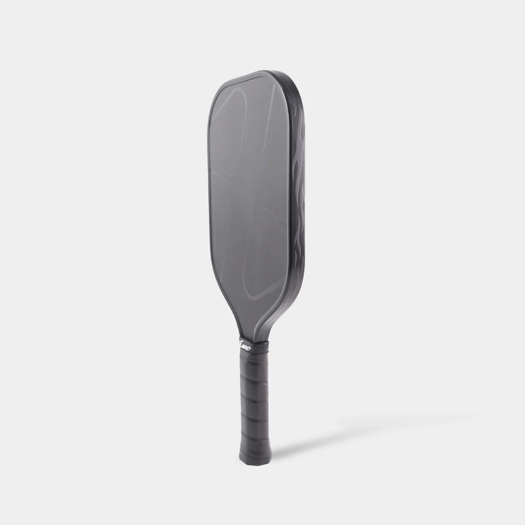 Side angle of LUZZ Pro 4 Darkness Inferno 16mm paddle showing elongated shape and grip